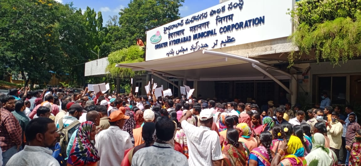 GHMC workers protest outside the Commissioner's office