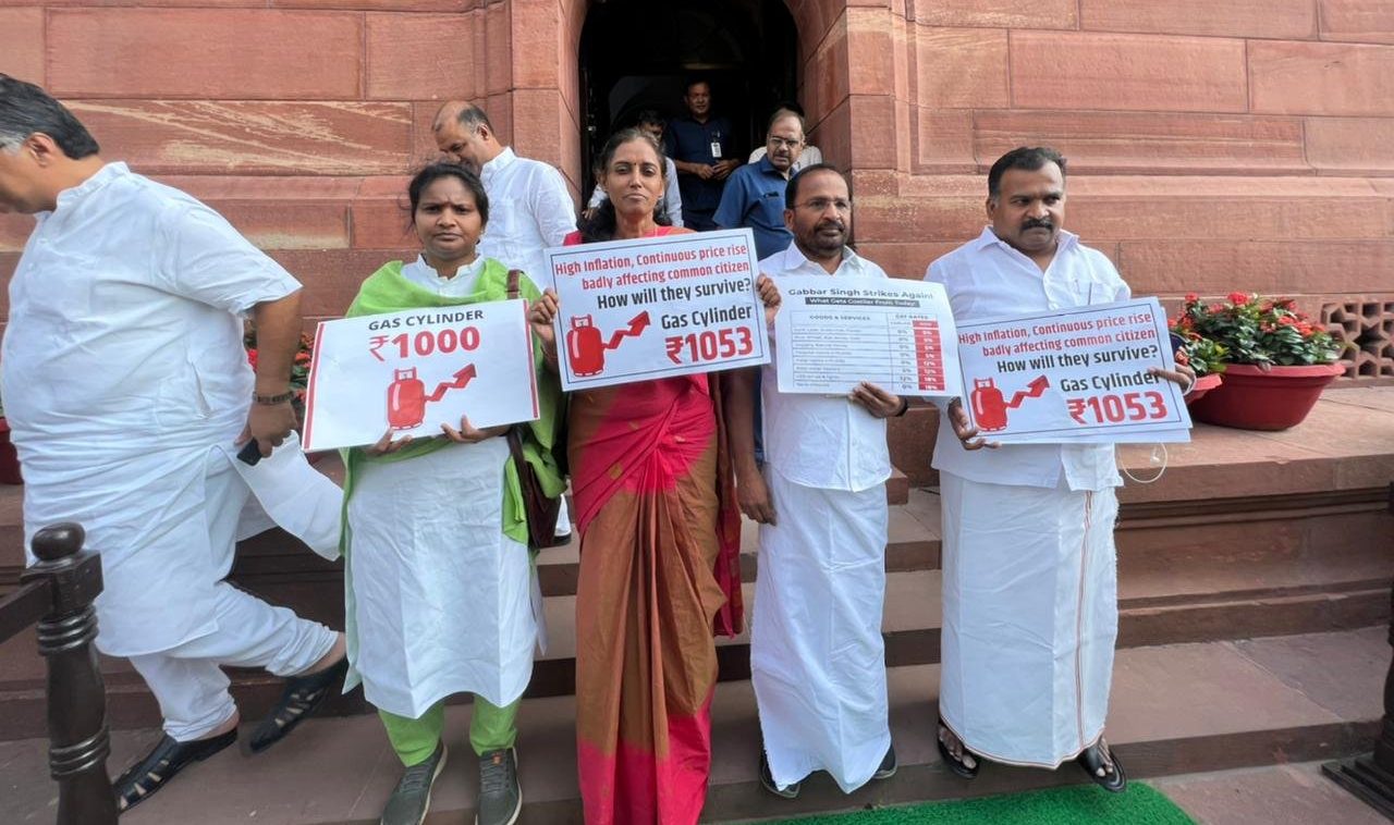 Suspended Congress MPs — (from left to right) Ramya Haridas (Alathur), Jothimani Sennimalai (Karur), TN Prathapan (Thrissur), and Manickam Tagore (Virudhnagar) displaying placards inside the Parliament complex. (Tamil Nadu Congress Committee / Twitter)