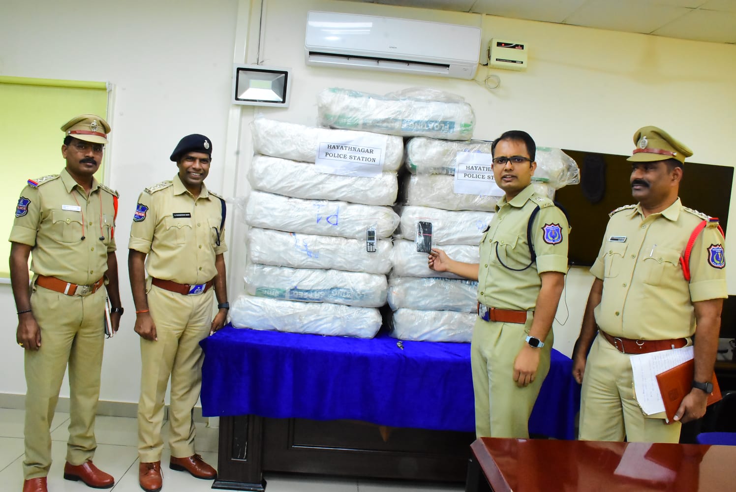 Police with seized marijuana. (Supplied)