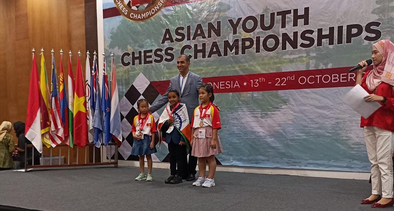 Charvi Anilkumar in the centre, along with Vietnam's Vo Mail Phuong and Duong Ngoc Nga. (Supplied)