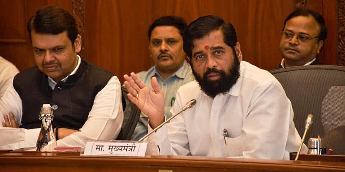 Maharashtra Chief Minister Eknath Shinde (right) with Deputy Chief Minister Devendra Fadnavis at an all-party meeting on border issues on Monday, 22 November, 2022. (Supplied)