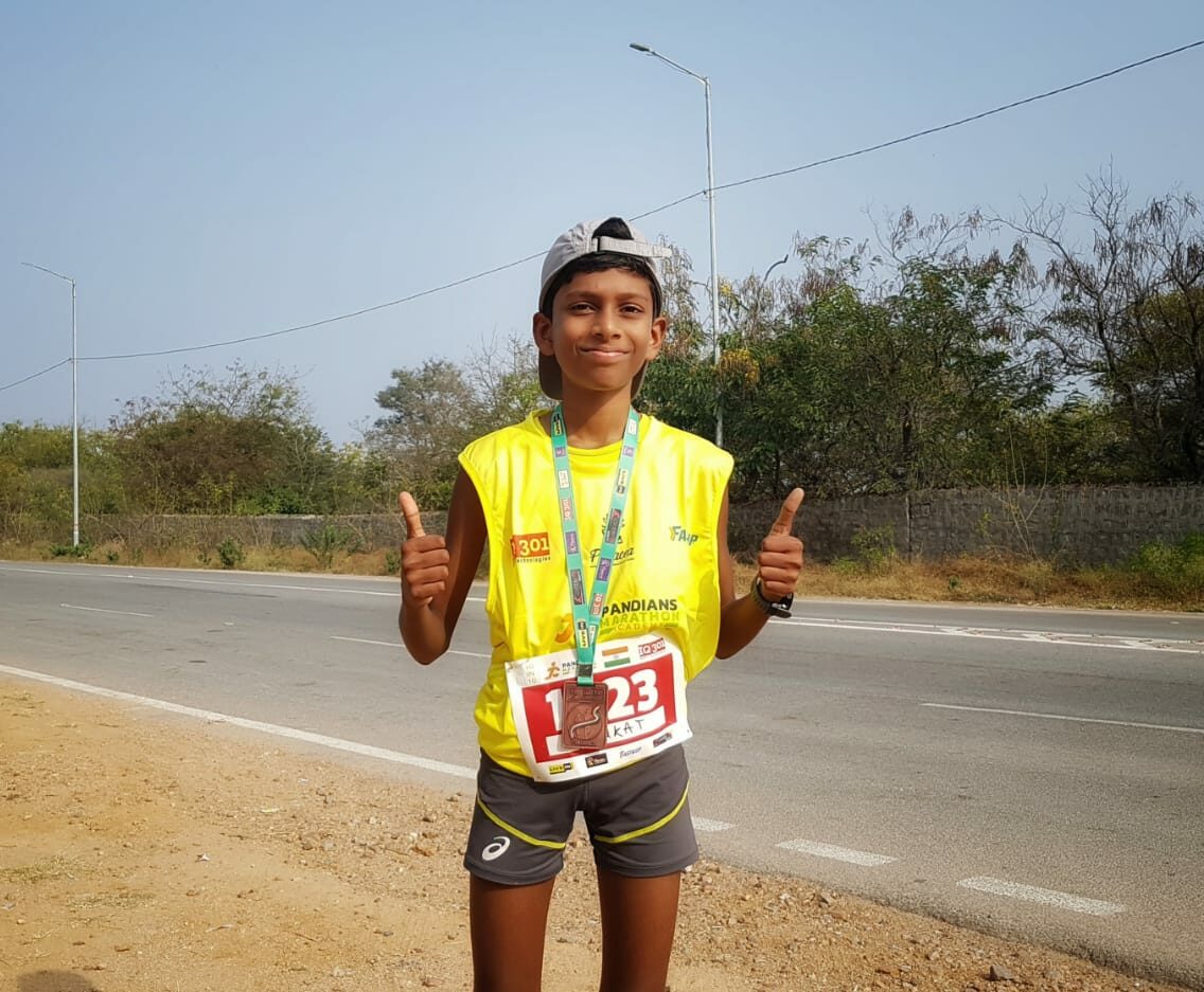 Venkat Reddy Hyderabad marathon ironman runner after winning a medal.