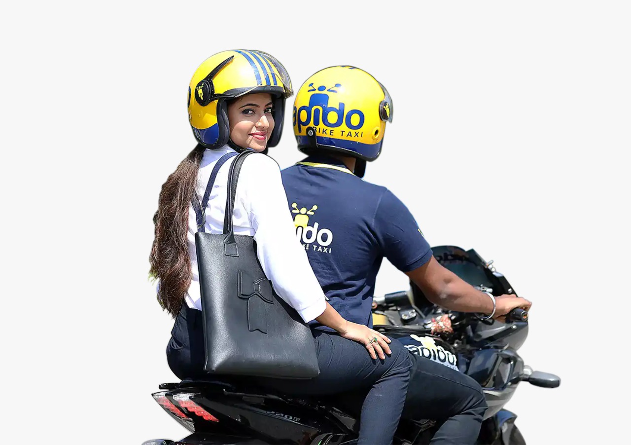 Rapido bike taxi rider and a passenger