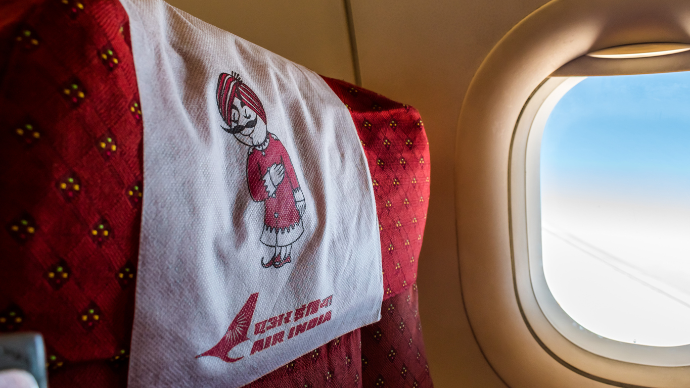Man peeing on woman Air India