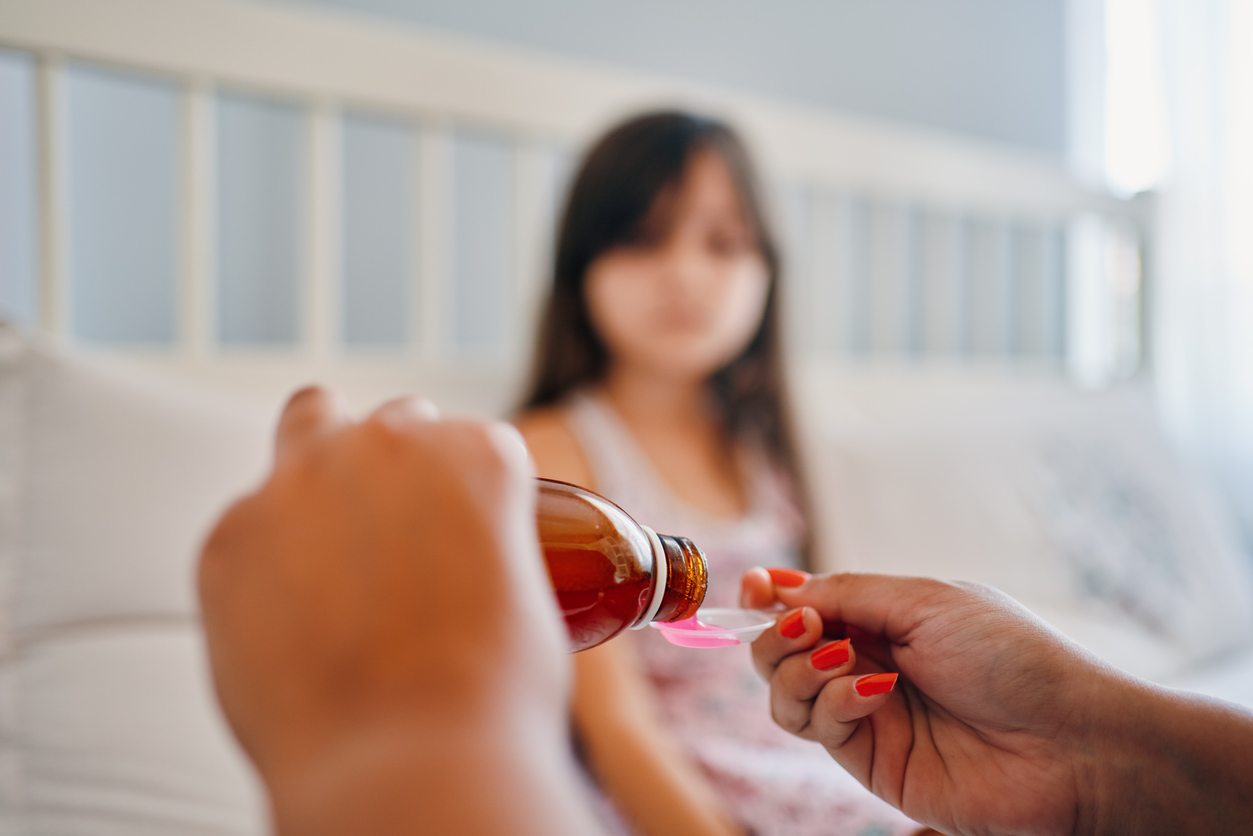 Child having cough syrup