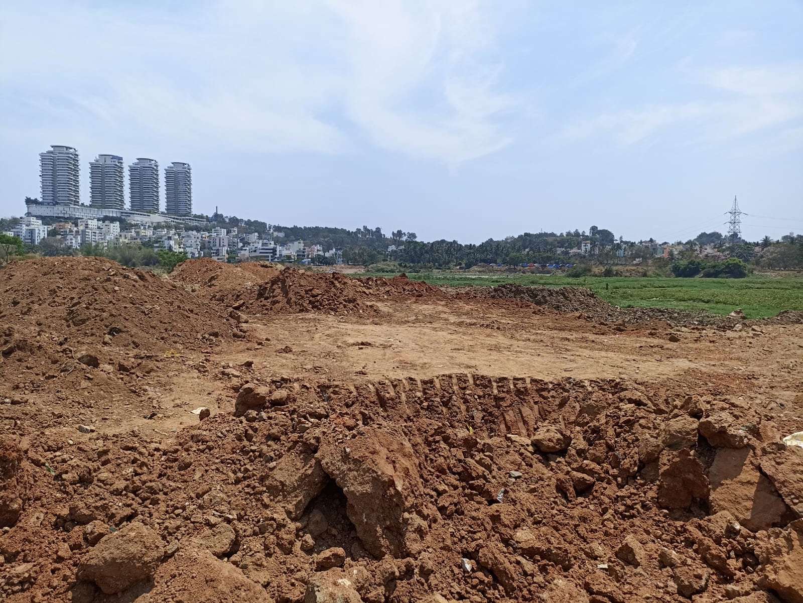 Hoskerehalli lake dumped with debris for muddy road
