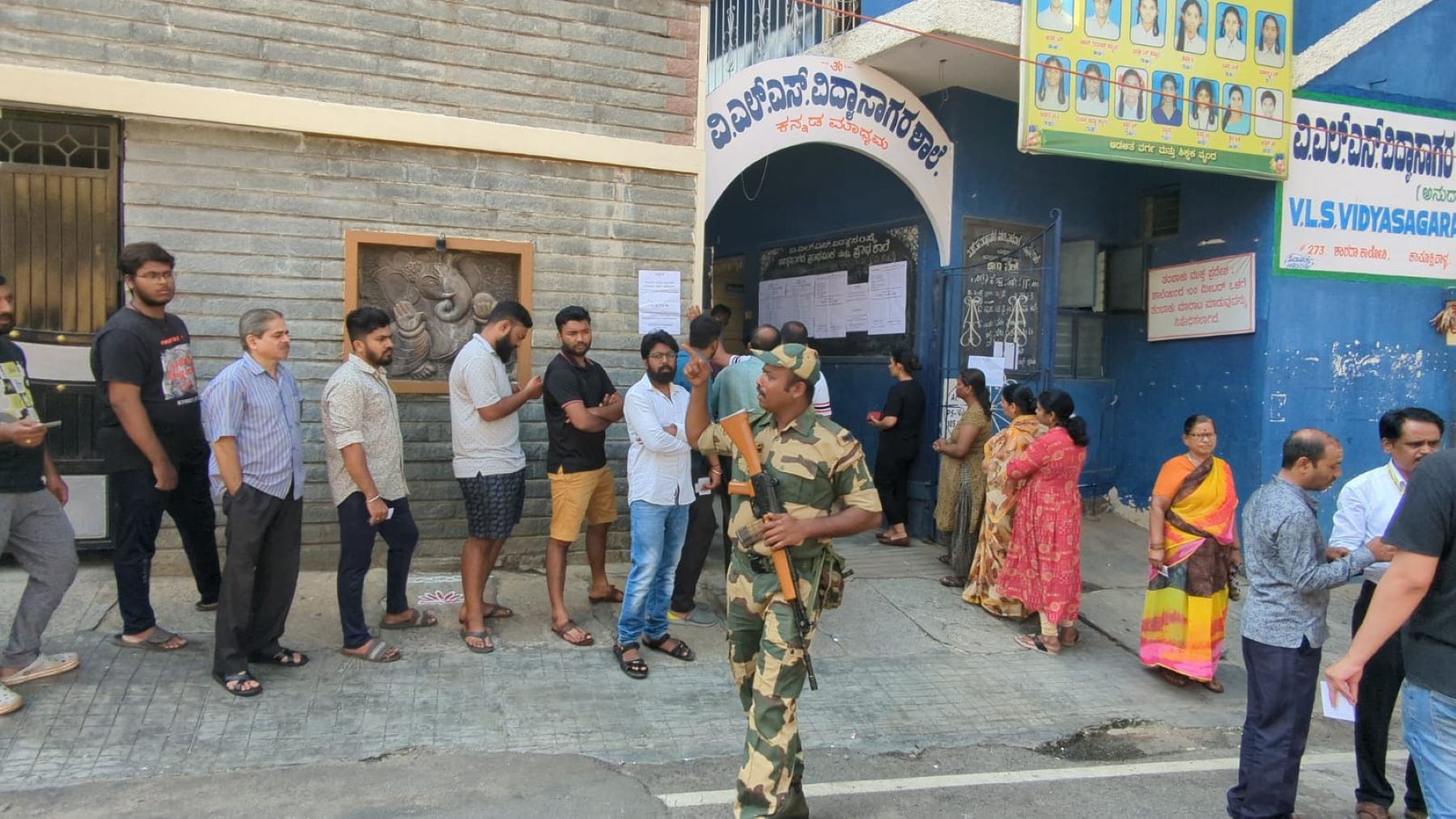 Karnataka Elections: Voters standing in line outside the polling station in Basavaeshwaranagara in Bengaluru City. (South First)