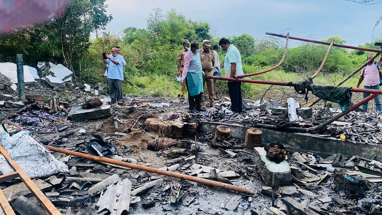Forensic experts inspecting the scene on Thursday. The building was completely destroyed in the blast that killed three people and injured six others. (Supplied)