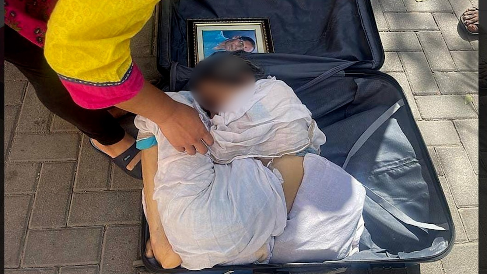 Victim Biva Pal's body inside the suitcase at Mico Layout police station