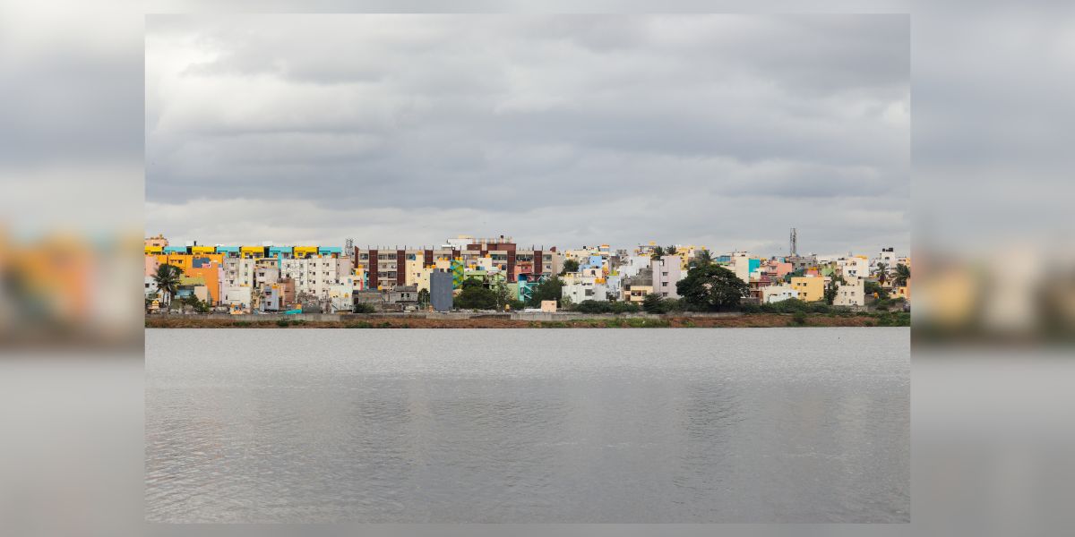 A cloud-covered Madiwala lake, Bengaluru, on 27 July 2023. As the July rains receded and the Sun started to peep out from the clouds, the lake saw many eager visitors. (Aaradhya Kiran)