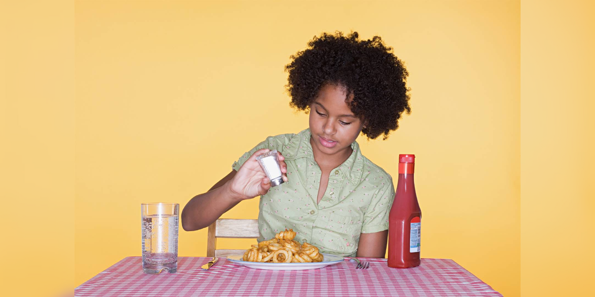 Excess salt consumption during childhood can lead to cravings for salty food as adults and cause hypertension. (Wikimedia Common)