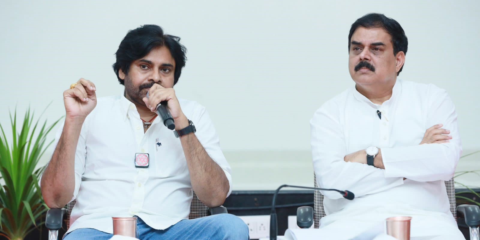 Jana Sena chief Pawan Kalyan (left) speaks to party members at Mangalagiri in Andhra Pradesh on Sunday, 10 September, 2023.