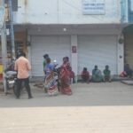 Daily wage labourers waiting for the contractor to come outside the Paradise hotel in Siddipet