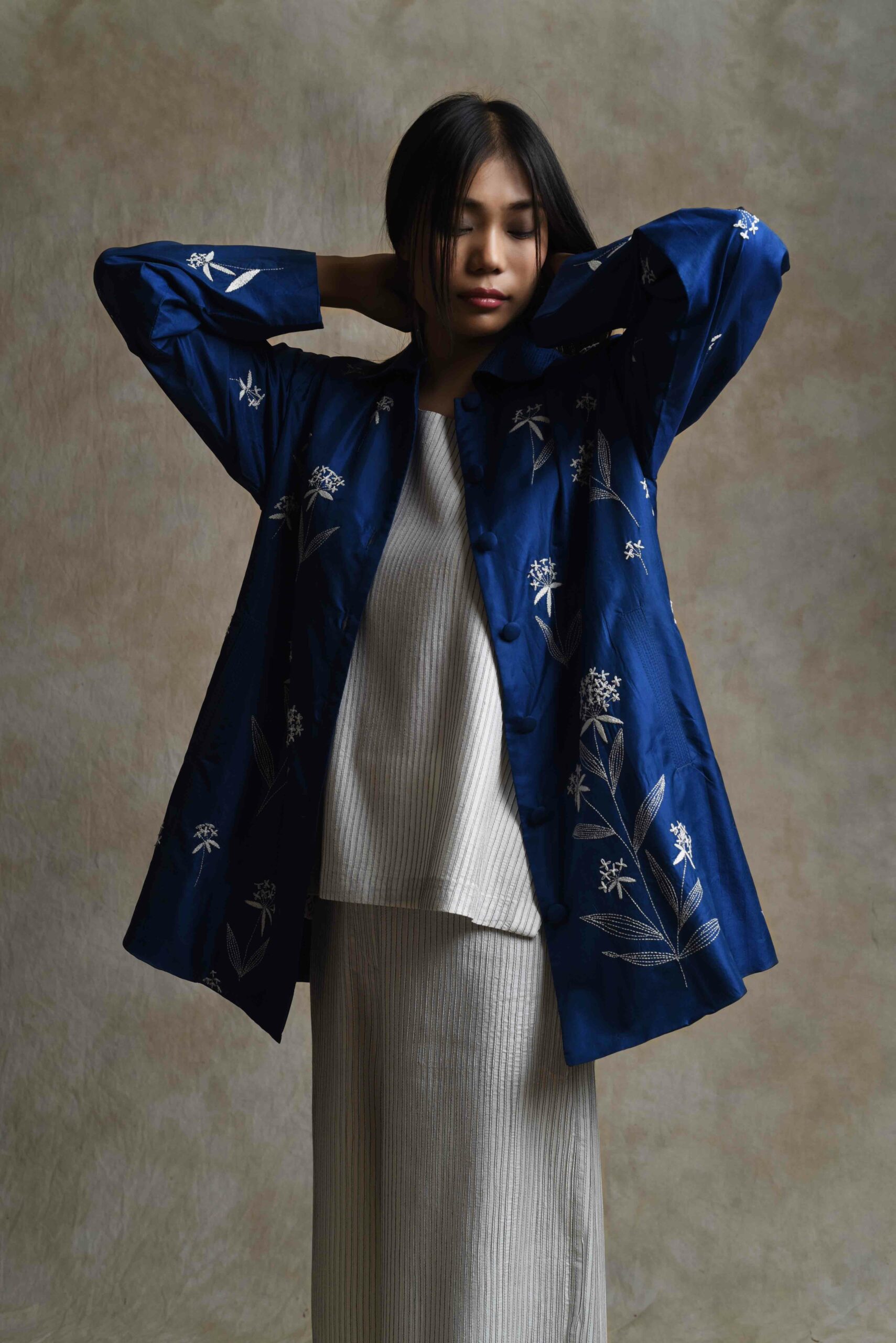 Sunita retraces the traditional art of Kantha, upcycling old textiles into wearable art. (Supplied)