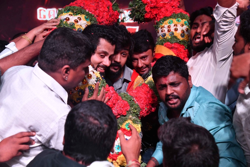 Star cast of the film Bad Manners being garlanded by fans