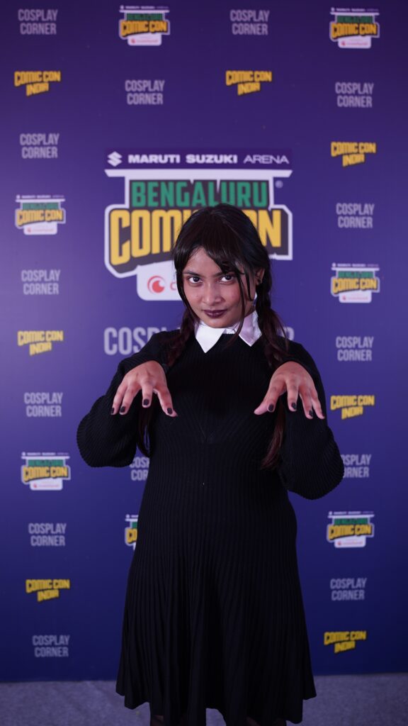 "There are monsters everywhere." A cosplayer dressed as Wednesday Addams. (Supplied)