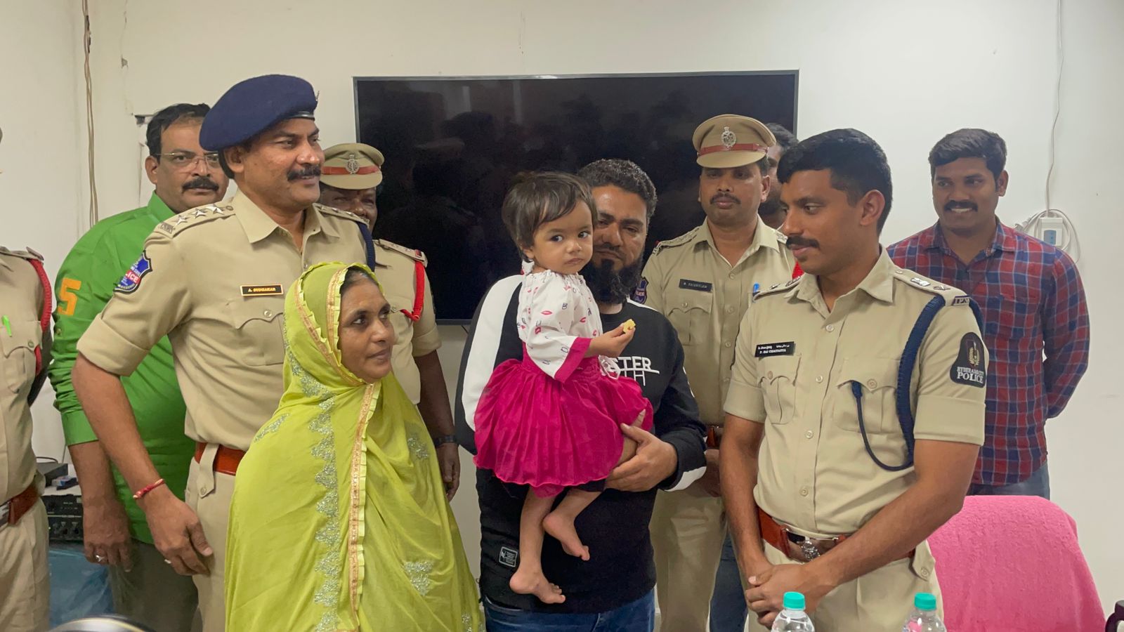 P Sai Chaitanya, Dy Commissioner of Police, South Zone with rescued family (Supplied)