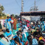 Anganwadi workers protesting under the scorching sun in Vijayawada.