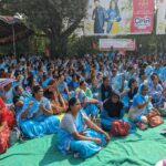 Anganwadi workers chant slogans requesting the government to respond.