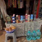 Alcohol, Coconuts, Vermilion and turmeric for sale at a shop