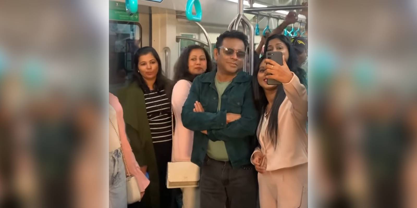 AR Rahman posing for a selfie with fans at Kochi Metro