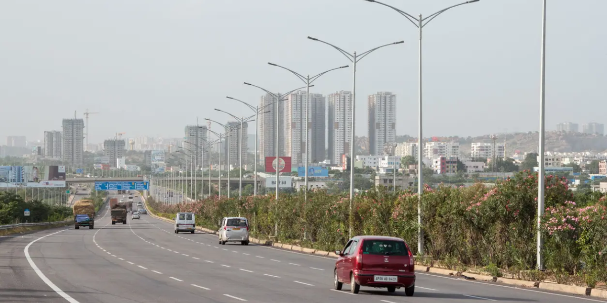 Vehicles speed along the Nehru Outer Ring Road against the background of high-rise buildings in Hyderabad. (iStock)