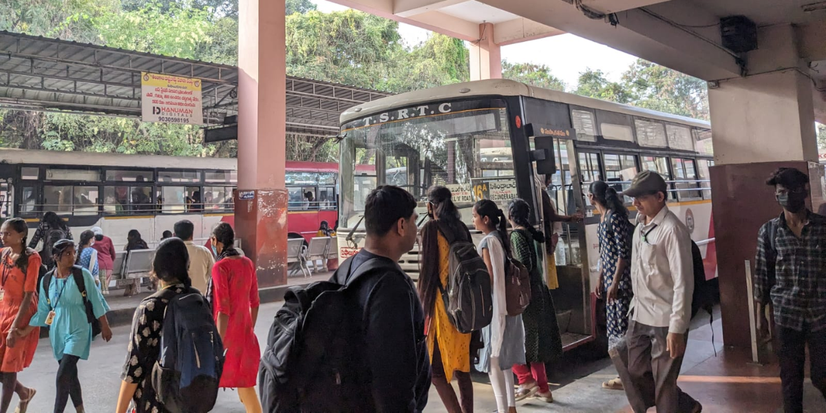 Women waiting to board an RTC bus at ECIL depot. (Deepika Pasham/South First)