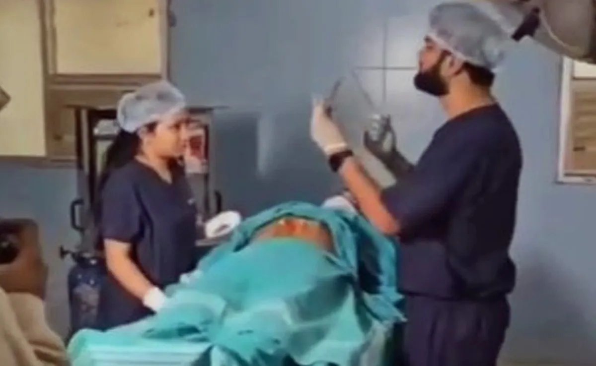 Dr Abhishek was seen performing a mock surgery with his fiancée — both in scrubs — on a 'patient'. (Screengrab)