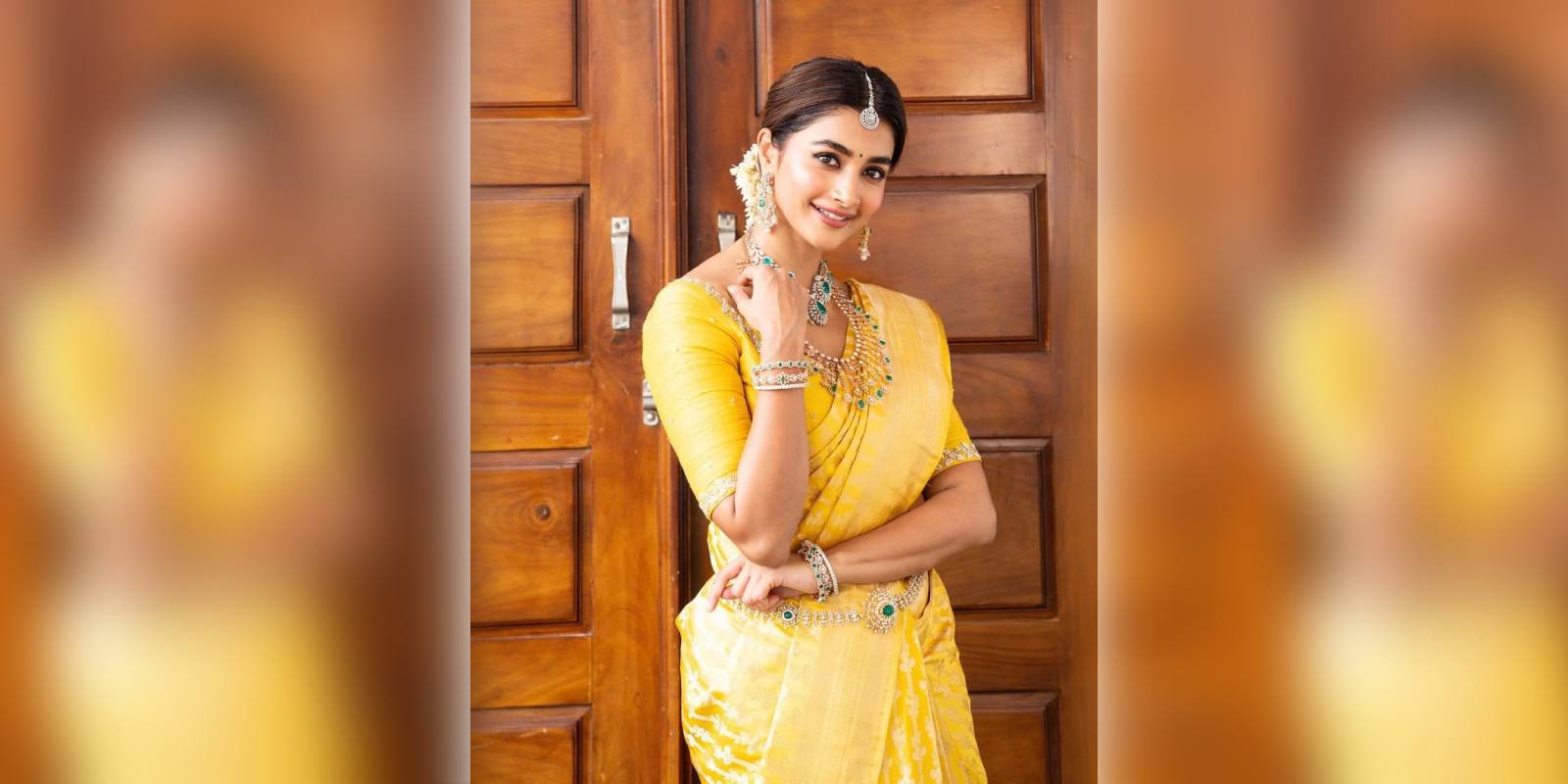 Pooja Hegde shines in a yellow silk saree