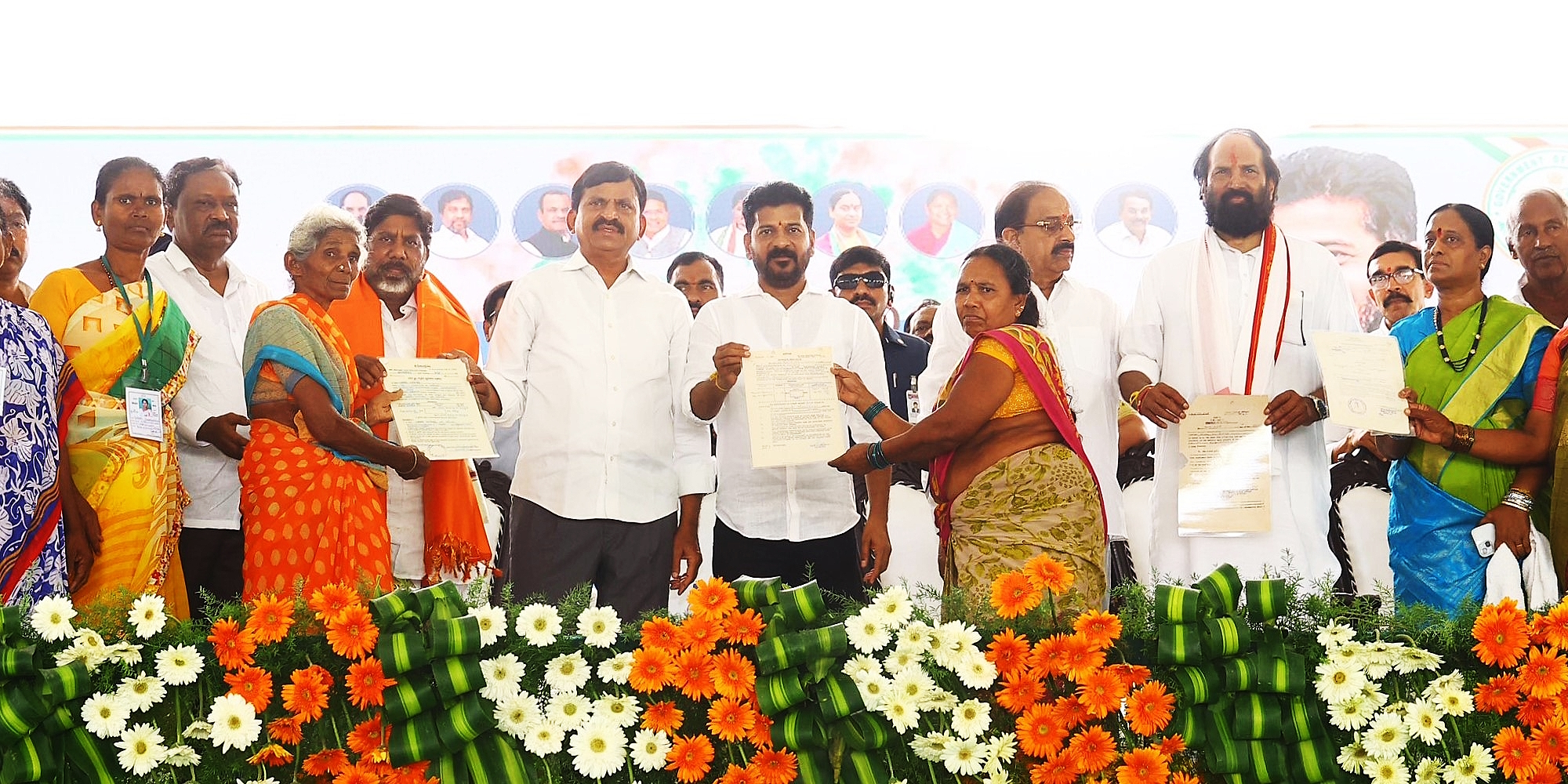 Telangana government leaders, including Chief Minister A Revanth Reddy, present Indiramma House pattas to women on Monday, 11 March, 2024.