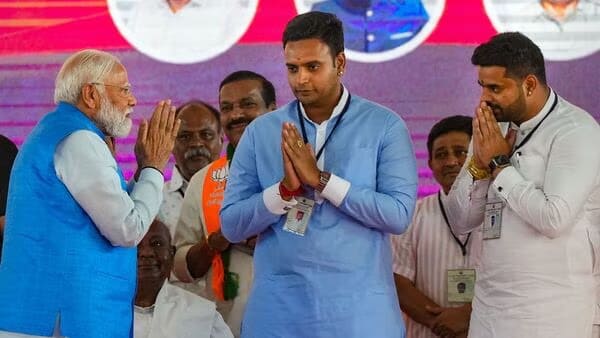 Prime Minister Narendra Modi with JD(S) candidate Prajwal Revanna (right) during the poll campaign. (X)