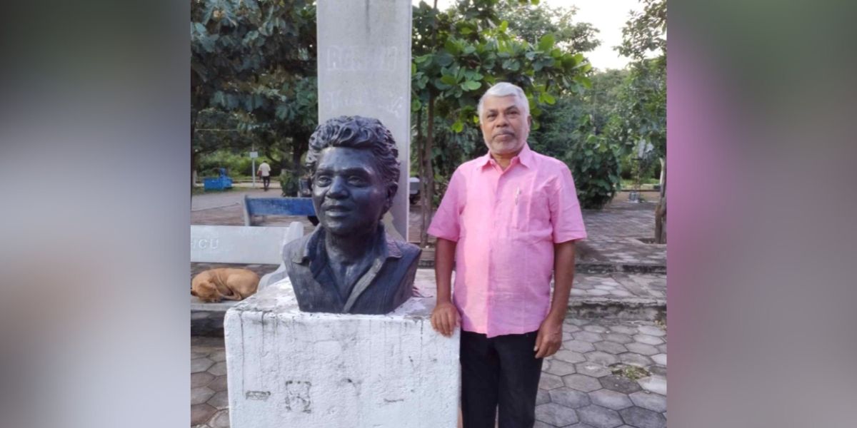 Perumal Murugan in front of a sculpture of Rohith Vemula.