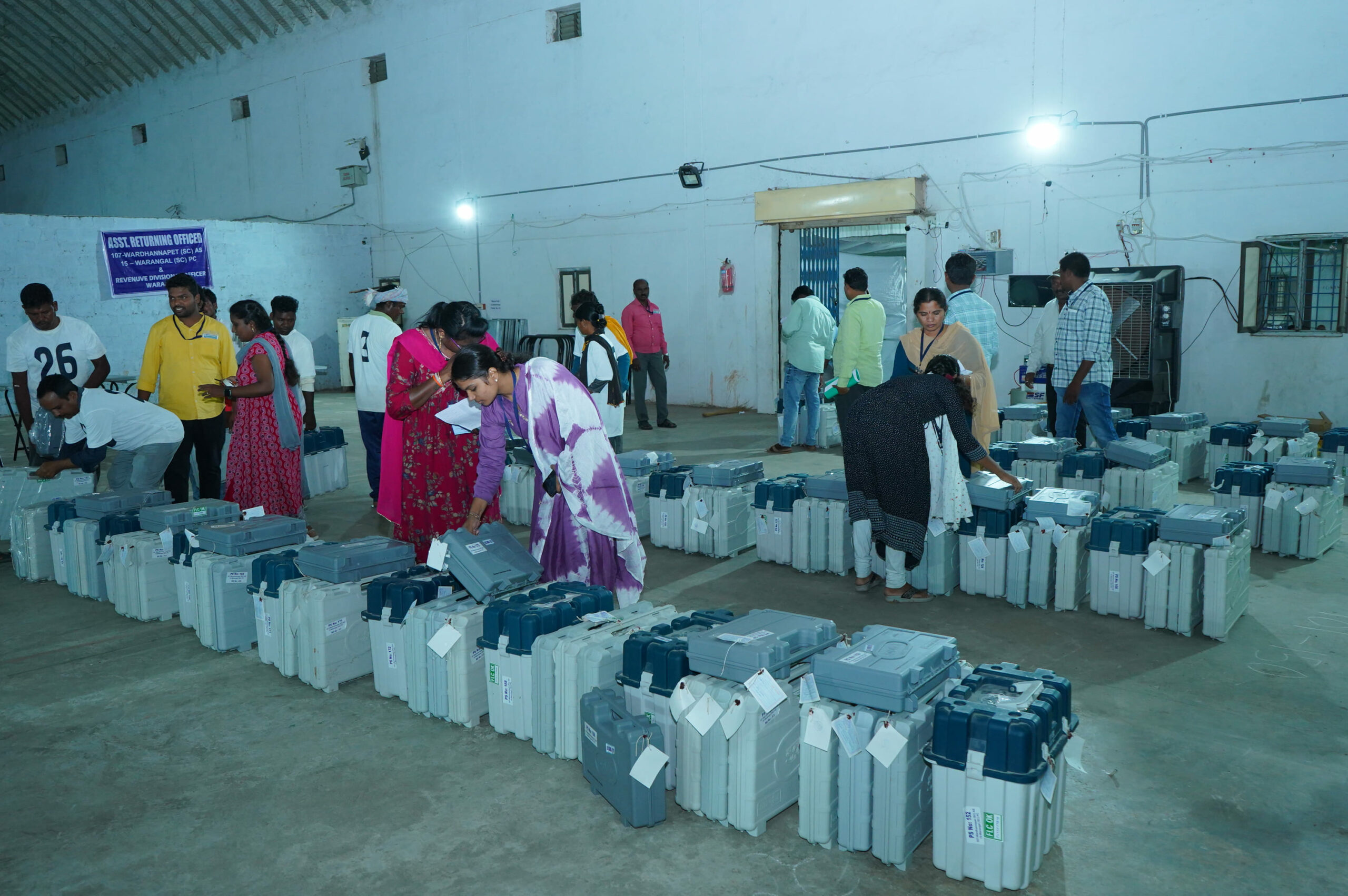 EVMs are secured in strongrooms, and they will be taken out on the date of counting. In picture, polling officials storing EVMs in a strongroom in Telangana's Warangal. (ECI Website)