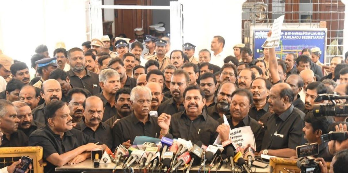 AIADMK members address the press outside Assembly