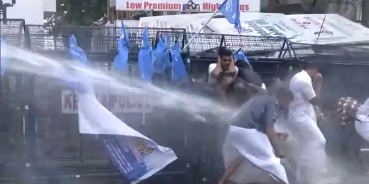 Police using water cannons against KSU workers. (X)