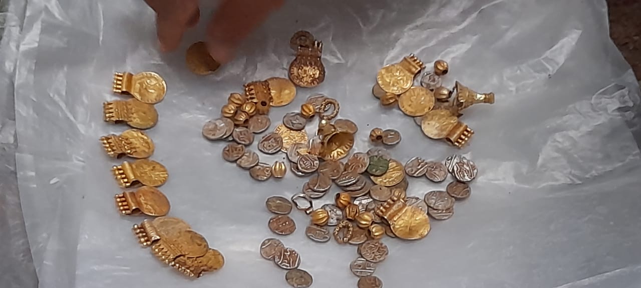 The chest contained gold-like beads, lockets, medallions, rings, earrings and silver-like coins. (Supplied)