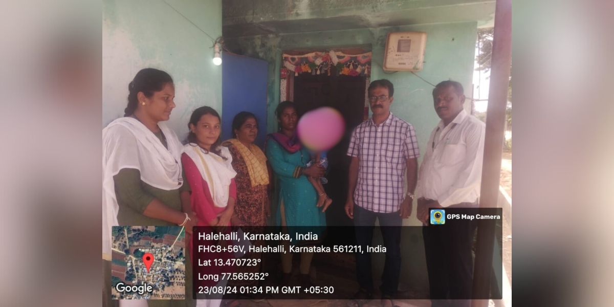 Officials visiting a family with a cerebral palsy affected child.