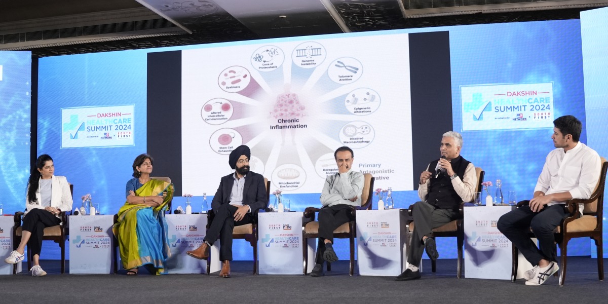Dr Deepak Saini (second, right) speaking at the summit. (South First)