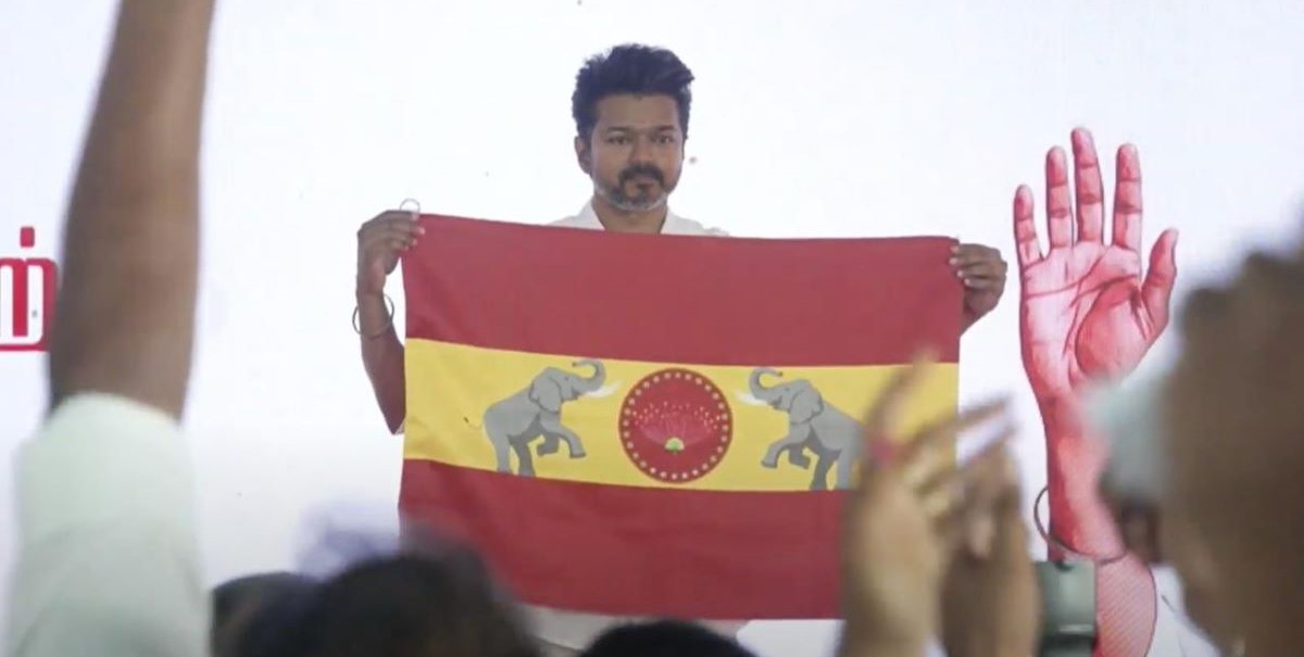 Vijay with the TVK flag