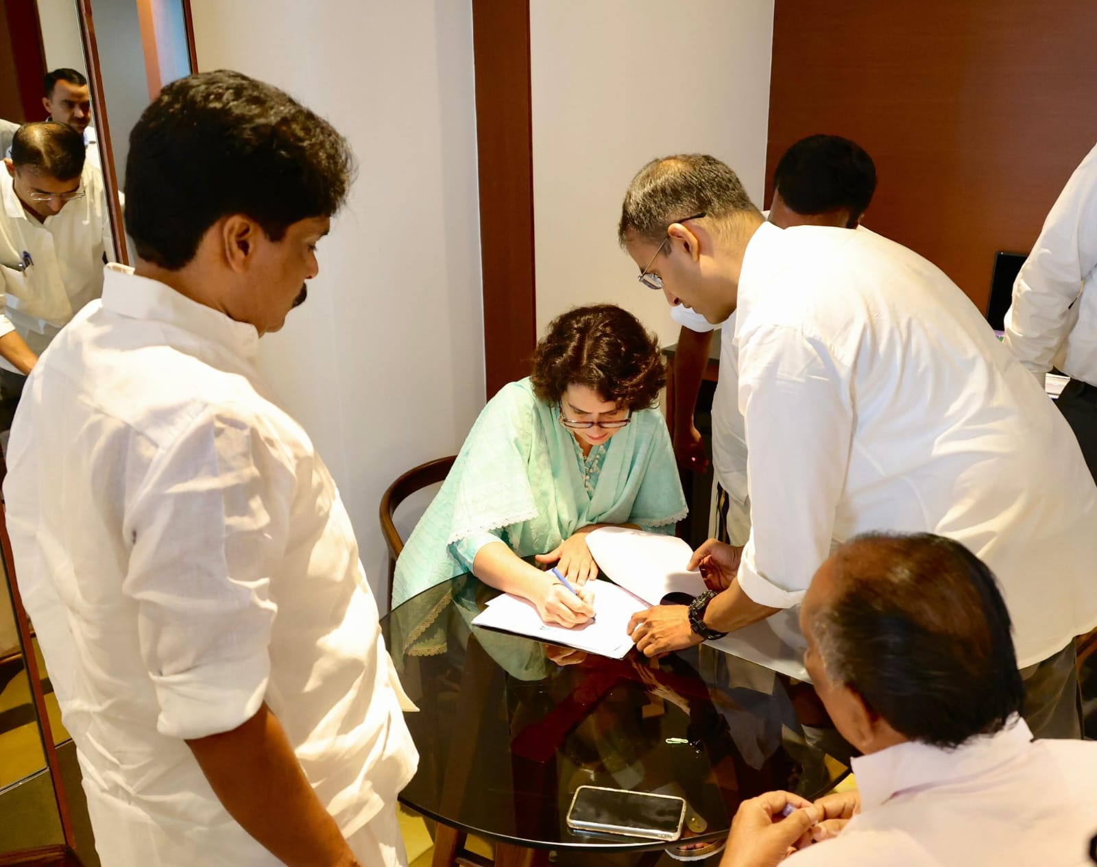 Priyanka Gandhi Vadra signing the nomination paper before submitting them in Wayanad on Wednesday. (Supplied)