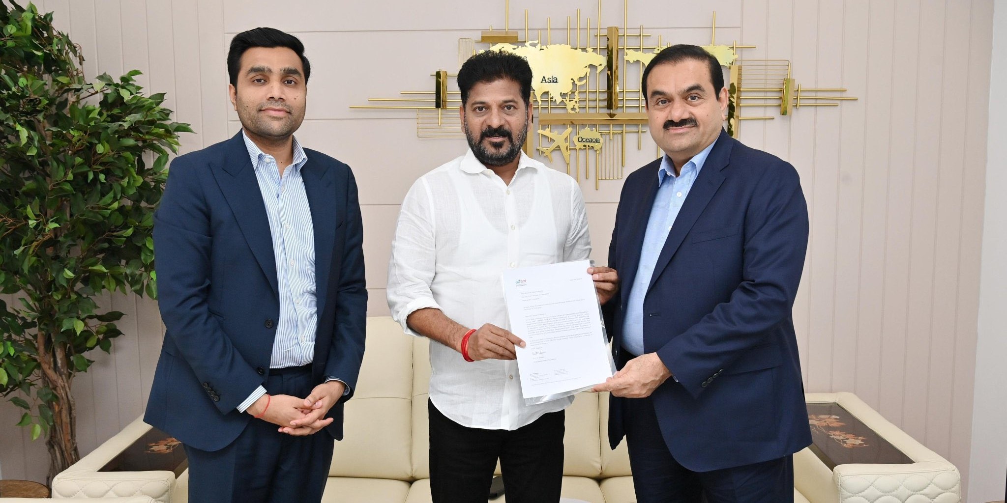 Revanth Reddy with Gautam Adani and Karan Adani. (X)