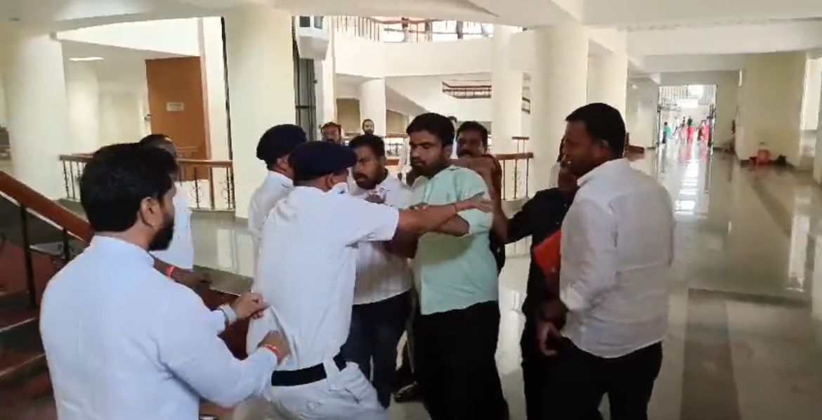 Supporters of Minister for Women and Child Welfare Laxmi Hebbalkar trying to attack BJP MLC CT Ravi at Suvarna Vidhana Soudha. (Screengrab)
