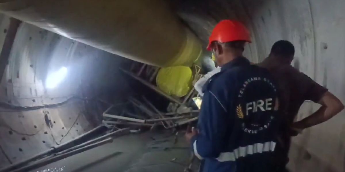 Rescue team members inside the tunnel calling out the names of the trapped workers.
