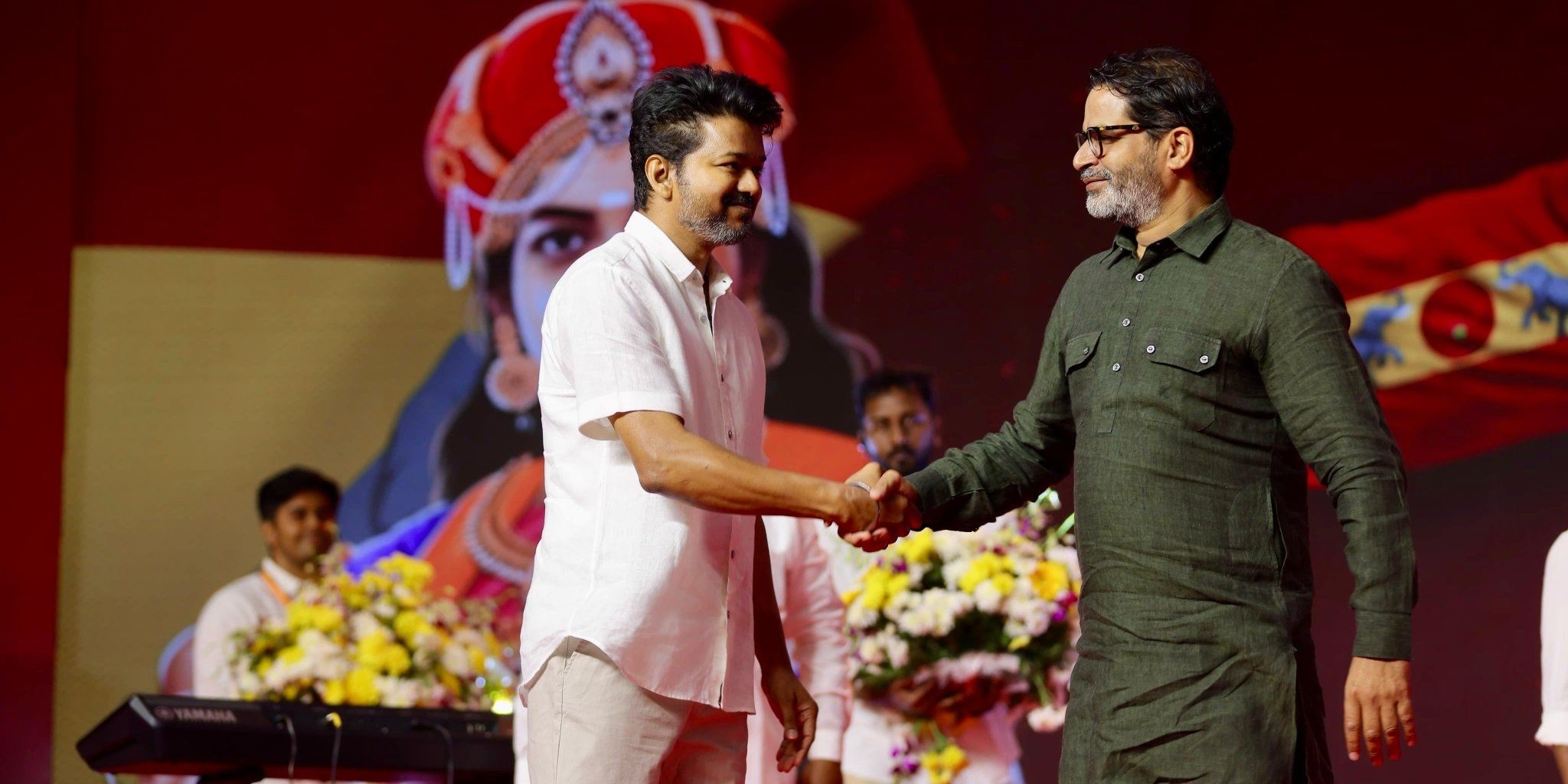 Vijay and Prashant Kishor during a TVK programme. (X)