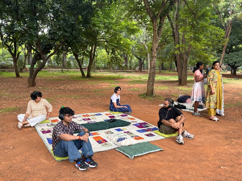 Visitors listening to stories on the Sonic Blanket. (Supplied)
