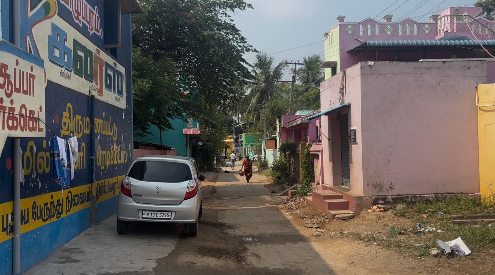 Houses on the right-hand side of the street have pattas, while those opposite do not since they are claimed to be on Waqf land.