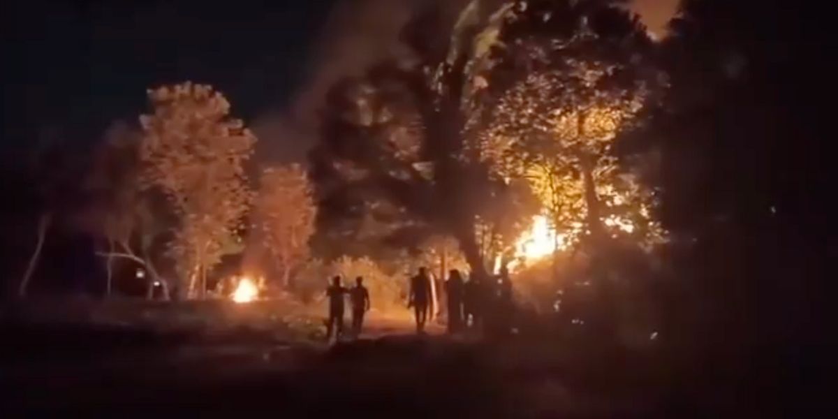 A hut was set on fire, the windows and doors of at least ten homes were smashed, and multiple vehicles were set ablaze.