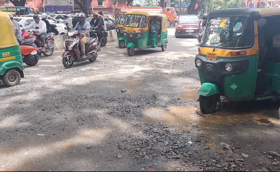 From the bustling streets of Rajajinagar to the tech corridors of Whitefield, commuters across Bengaluru are navigating roads riddled with potholes and long-standing neglect.