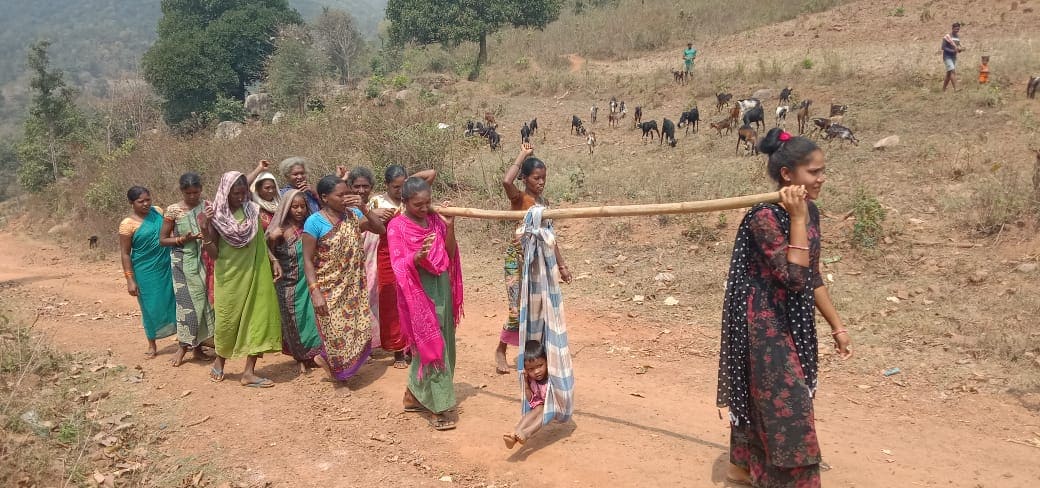 The tribals rely on dolis—makeshift bamboo stretchers carried by villagers—to transport patients on rugged trails.