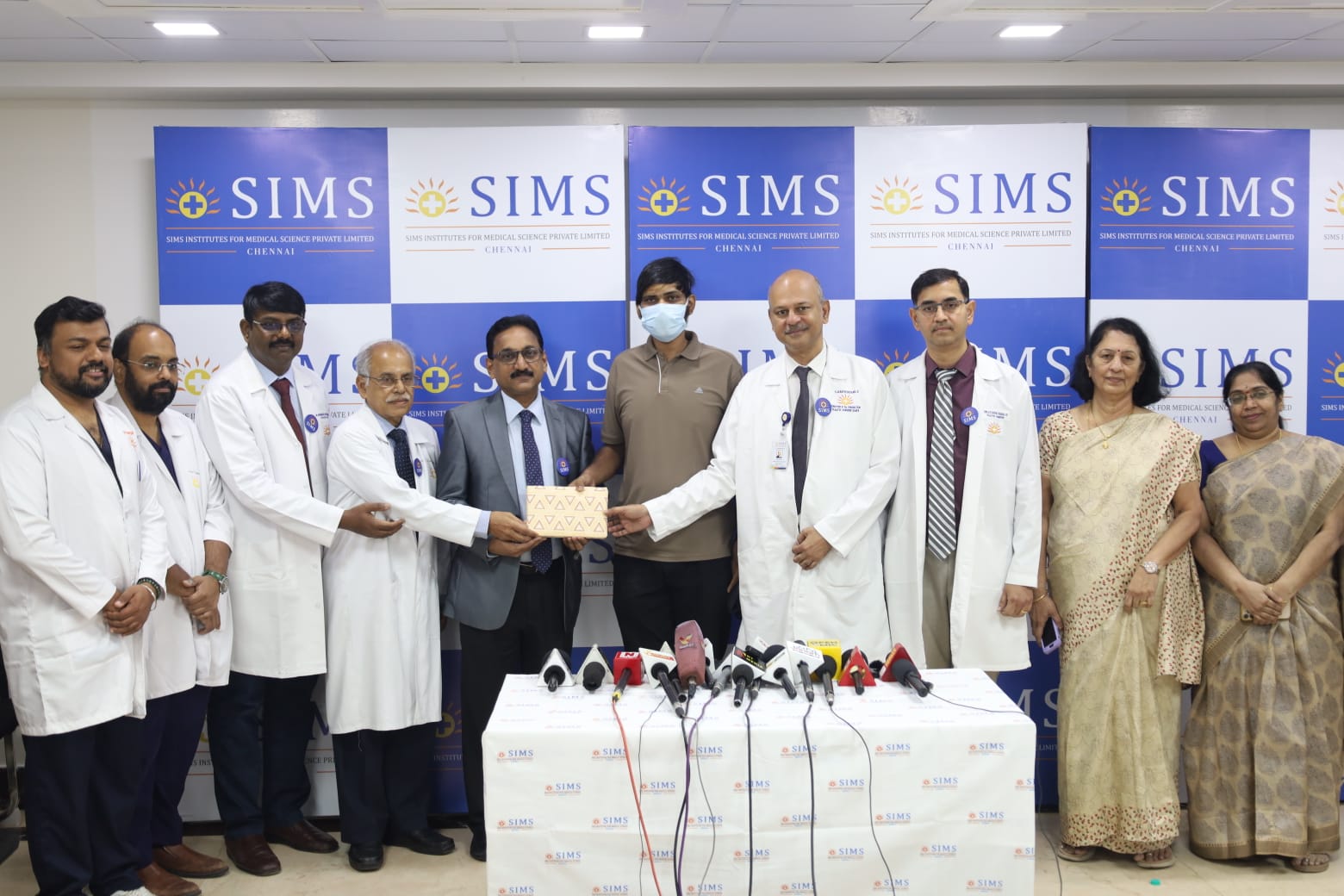 The patient with the team of doctors at SIMS who performed the surgery. (Supplied)